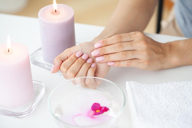 Woman making manicure when resting at home