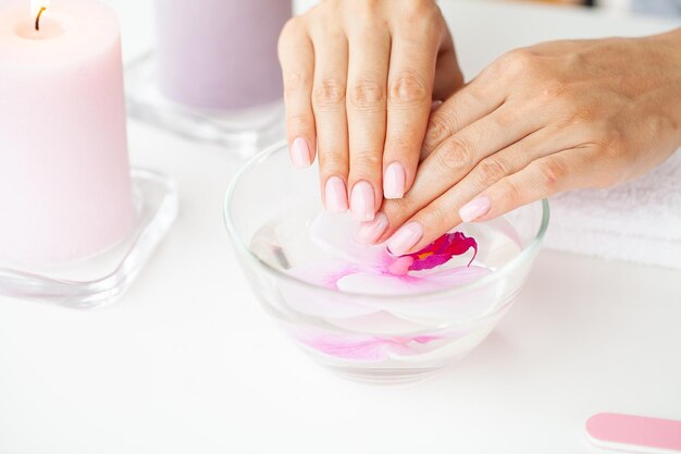 Woman making manicure when resting at home