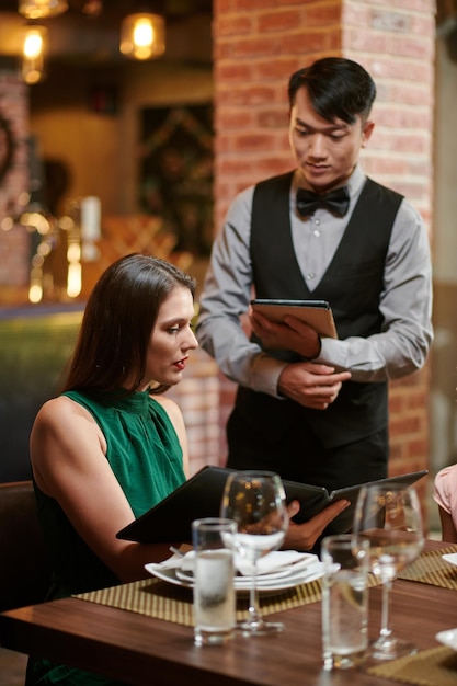 Woman Making Order in Restaurant