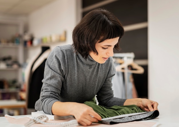 Woman making skirt at fabric