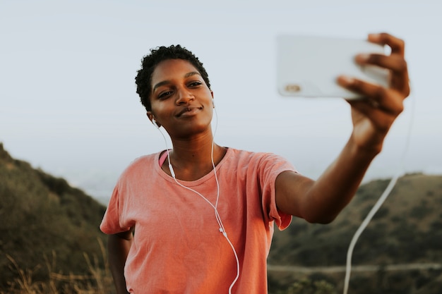 Woman making taking a selfie