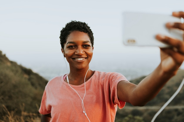 Woman making taking a selfie