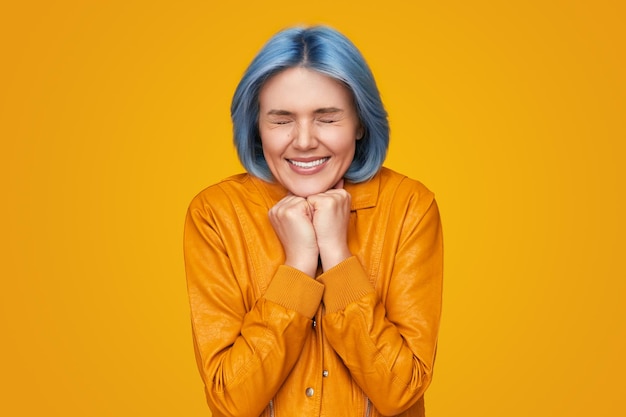 Woman making wish with closed eyes