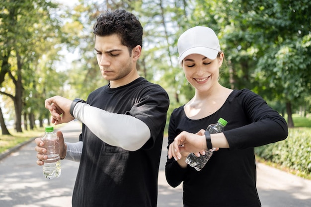 A woman and a man are running and doing sports on the street
sports weekends use fitness watches