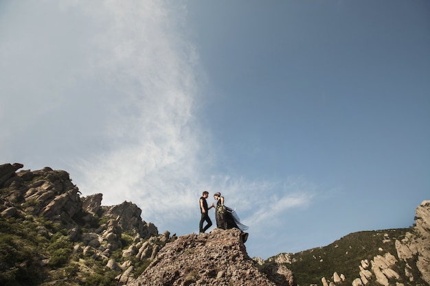 Woman and man in black clothes outdoors