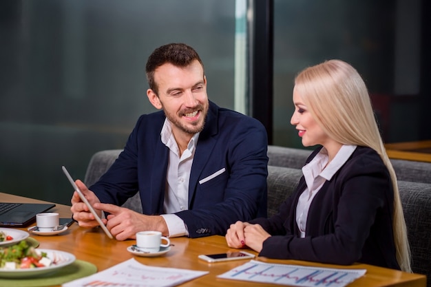 Woman and man on business lunch