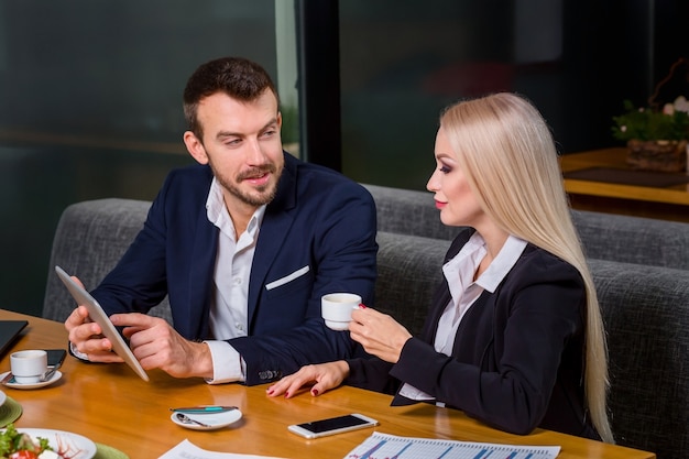 Woman and man on business lunch