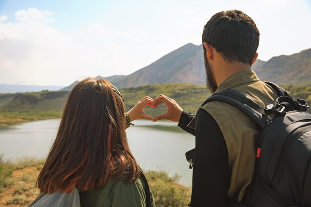 Woman and man hand heart sign