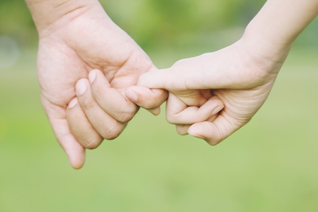 Woman and man holding hands, Happy couple lover in the park.	