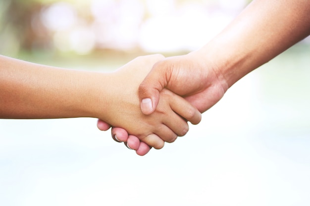 Woman and man holding hands