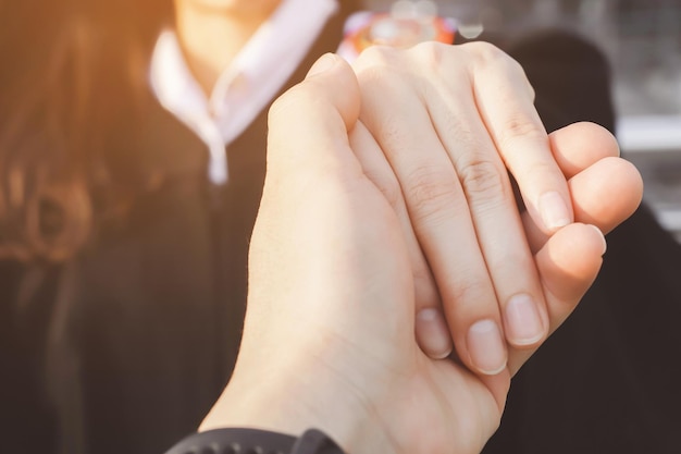 Woman and man holding Shake hands Happy couple love in the garden concept couple lover valentine day