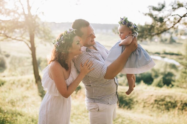 Woman and man playing with baby