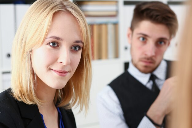 Woman and a man sit in office