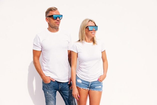 Photo woman and man wearing blank white tshirts mockup for t shirt design