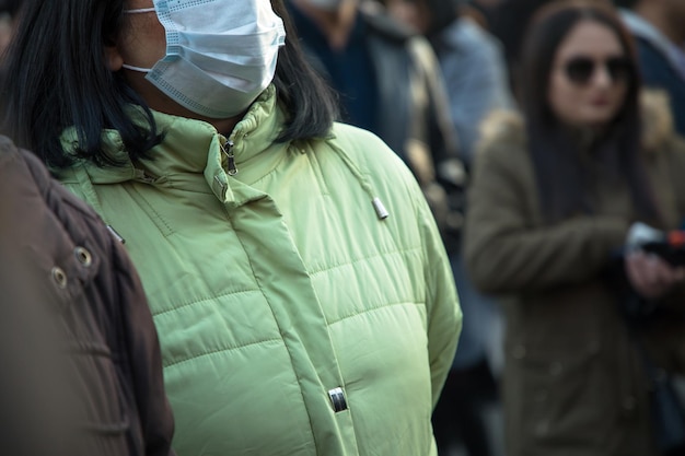 Woman in mask in street