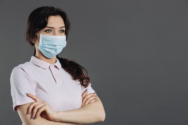 Woman in medical mask protecting from coronavirus. Home insulation and quarantine.