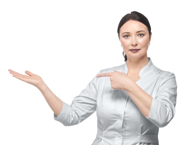 Woman in a medical white coat on a white background isolate