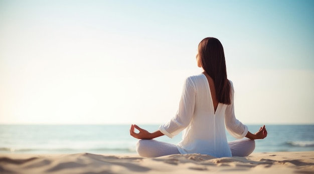 A woman meditating on the beach