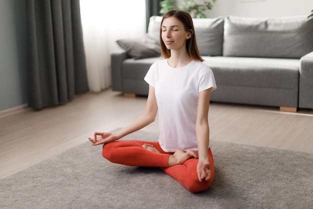 Woman meditating at home