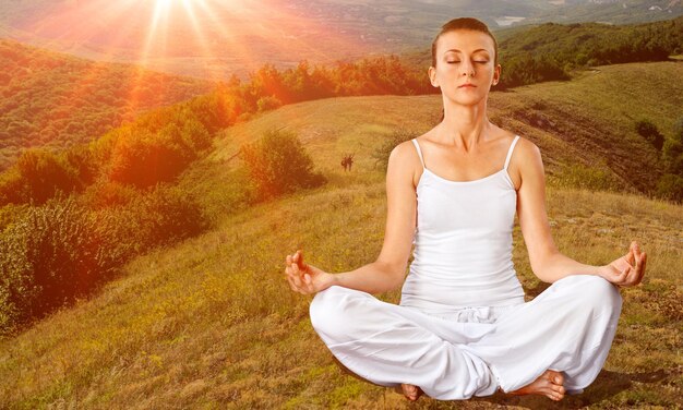 Woman meditating in Lotus Pose