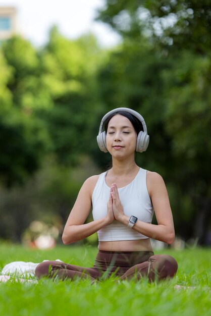 Woman do meditation at park