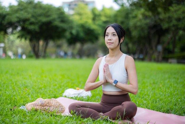 Woman do meditation at park