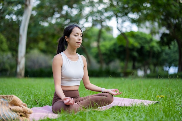 Woman do meditation at park