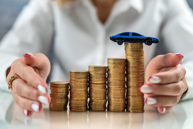 Woman on a mirrored table on a roller coaster with coins drives the car up