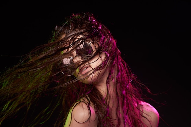 Woman model wearing sunglasses posing luxury studio lifestyle