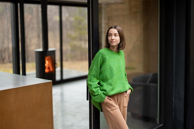 Woman at modern house on nature