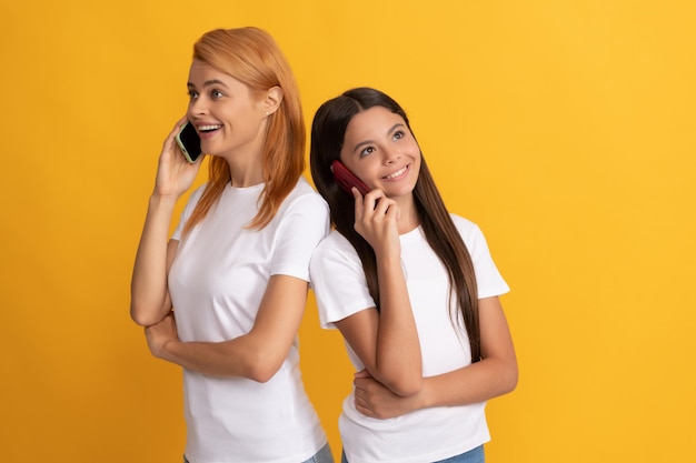 Woman mom and kid talking using modern smartphone, conversation.