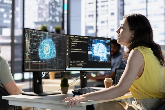 Woman monitoring and maintaining artificial intelligence company systems