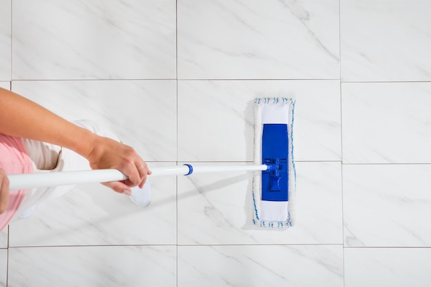 Woman Mopping The Floor