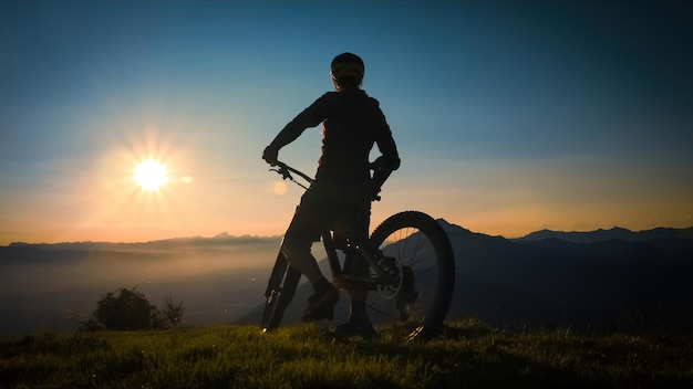 woman on mountain bike at sunset