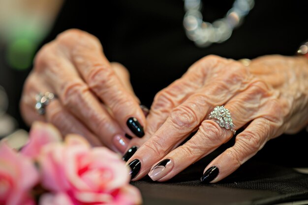 Woman in a nail salon receiving a manicure