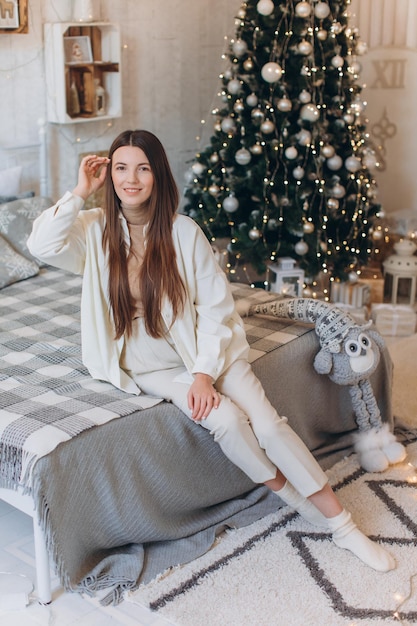 Woman near Christmas tree