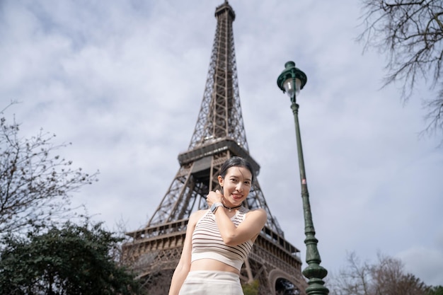 Woman near the Eiffel tower Paris France