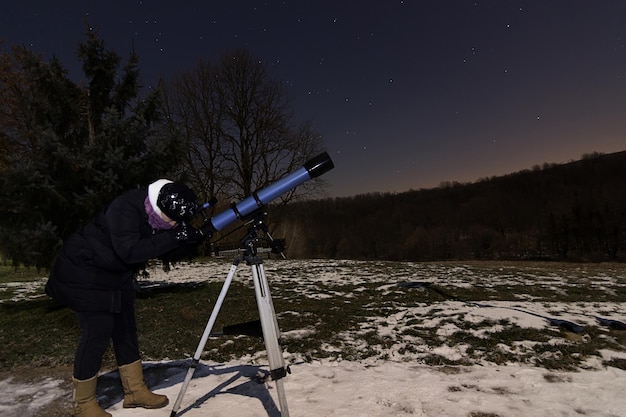 Woman and night sky constellations Draco Ursa Major Big Dipper