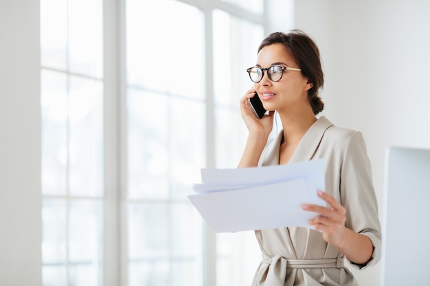 Woman at the office holding documents