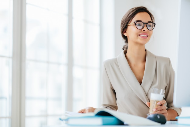 Woman at the office surrounded by documents