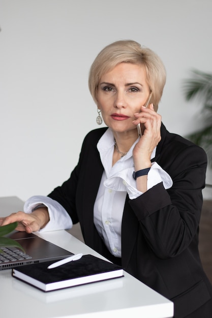 woman in office talking on the phone