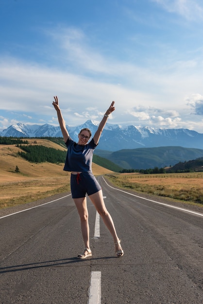 Woman om the chuysky trakt road in the altai mountains