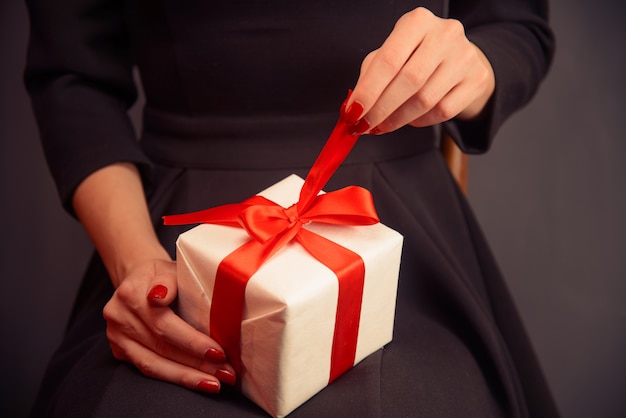 Woman opening a gift