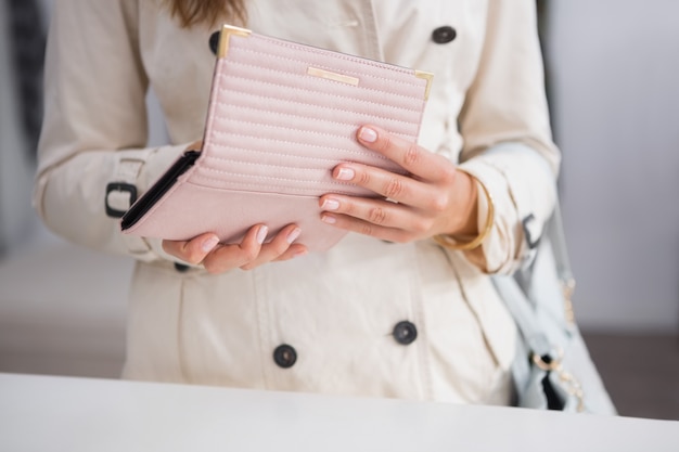 Woman opening her wallet