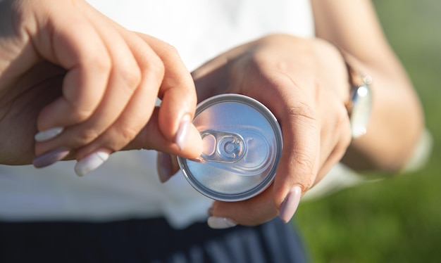 Woman opening a refreshing drink