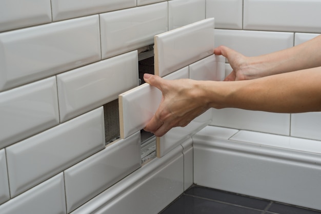 Woman opens, closes the hidden revision sanitary hatch