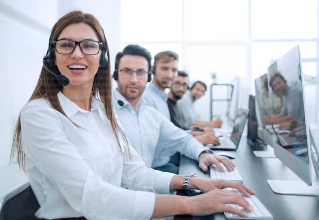 Woman operator in the workplace at the call centerphoto with copy space