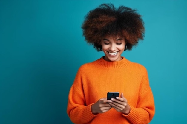 a woman in an orange sweater is texting on a phone