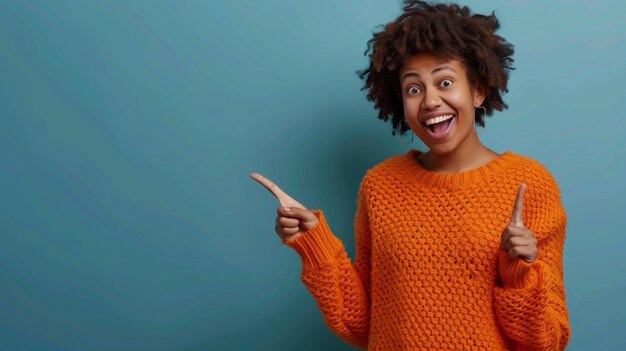 Photo woman in orange sweater pointing