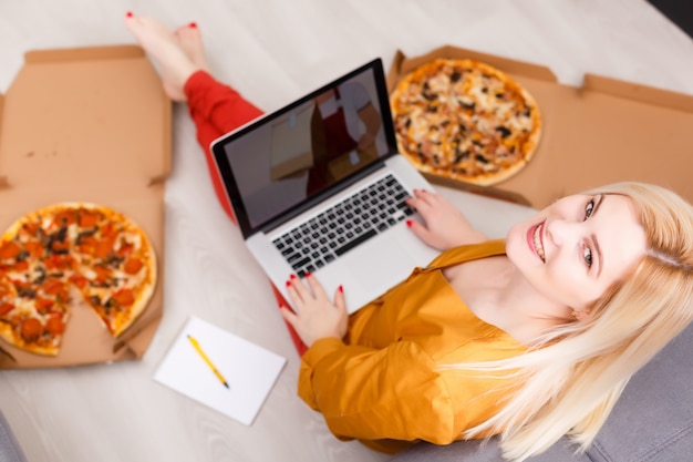 woman ordering pizza at home during quarantine